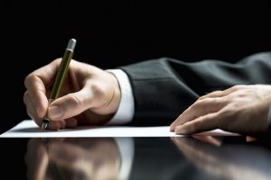 Businessman Writing A Letter Or Signing